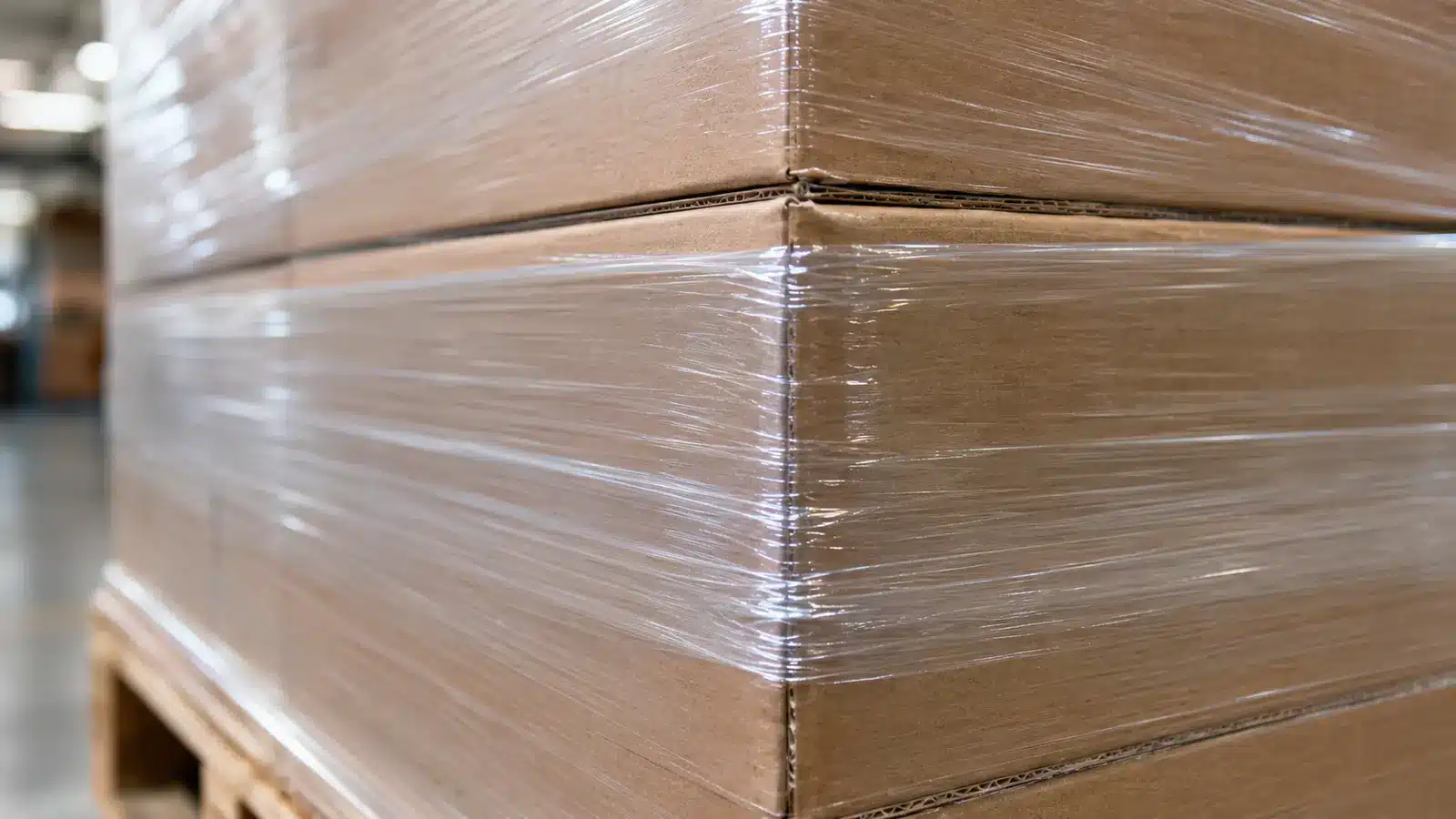 Concept illustration showing transparent stretch film layers conforming around a pallet corner